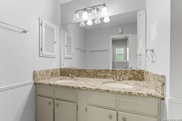 a white toilet sitting next to a bath tub