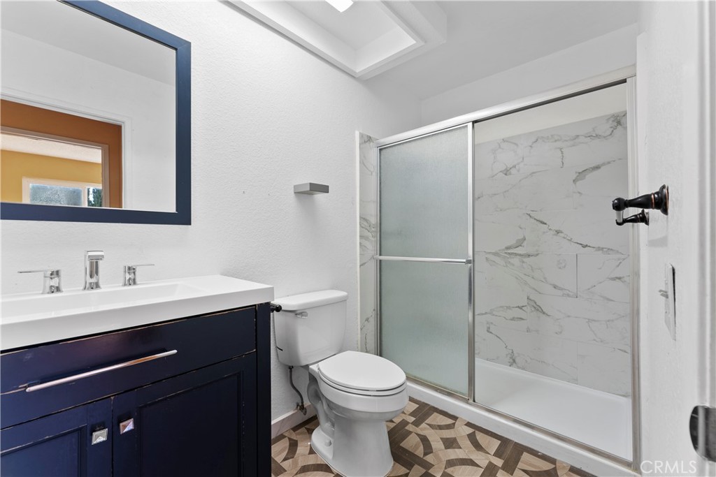 703 Pinto Circle Walnut, CA 91789 - Photo 33 of 54 a bathroom with a toilet a sink and shower