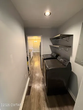 a storage room with washer and dryer