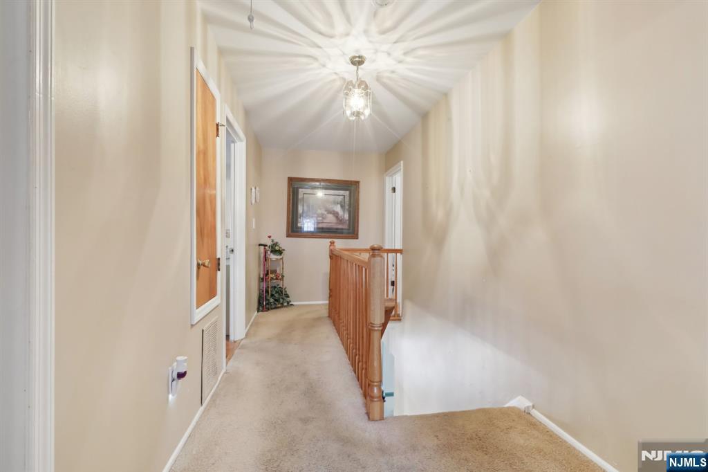 29 Joyce Drive Roxbury Township, NJ 07876 - Photo 15 of 31 wooden floor in an empty room with a window