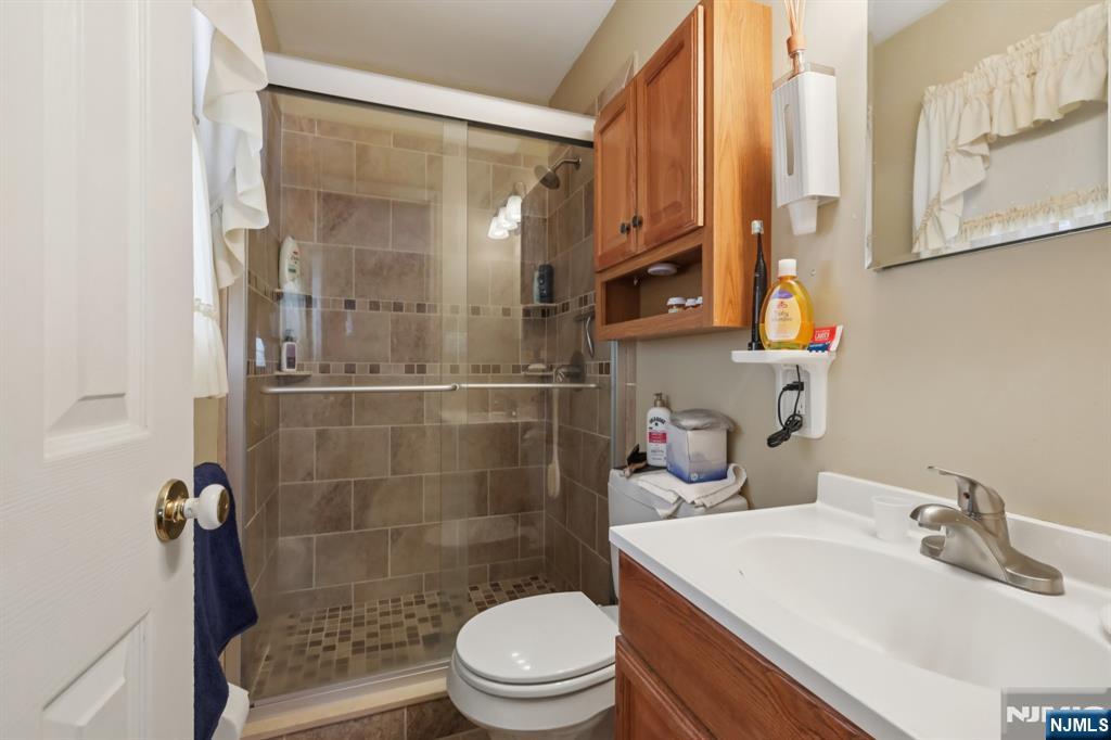 29 Joyce Drive Roxbury Township, NJ 07876 - Photo 18 of 31 a bathroom with a sink a toilet and shower