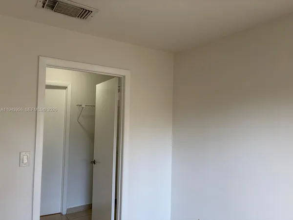 a view of a bathroom from a hallway