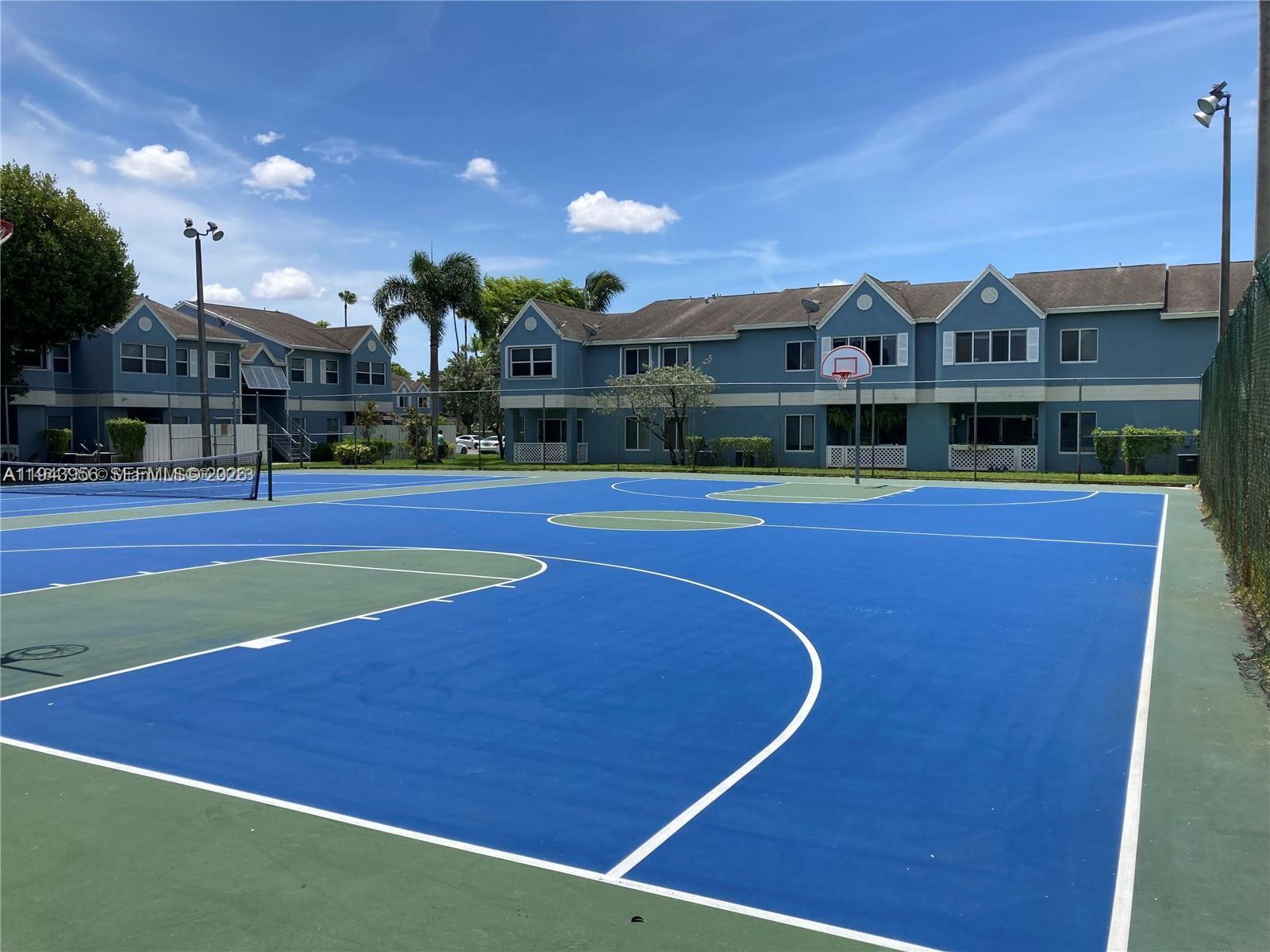 17320 Northwest 67th Place, Unit N7 Hialeah, FL 33015 - Photo 4 of 4 a view of a tennis court