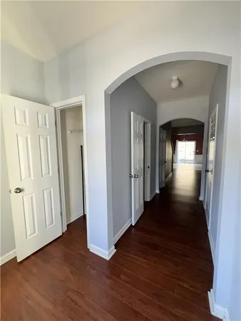 a view of gallery with wooden floor