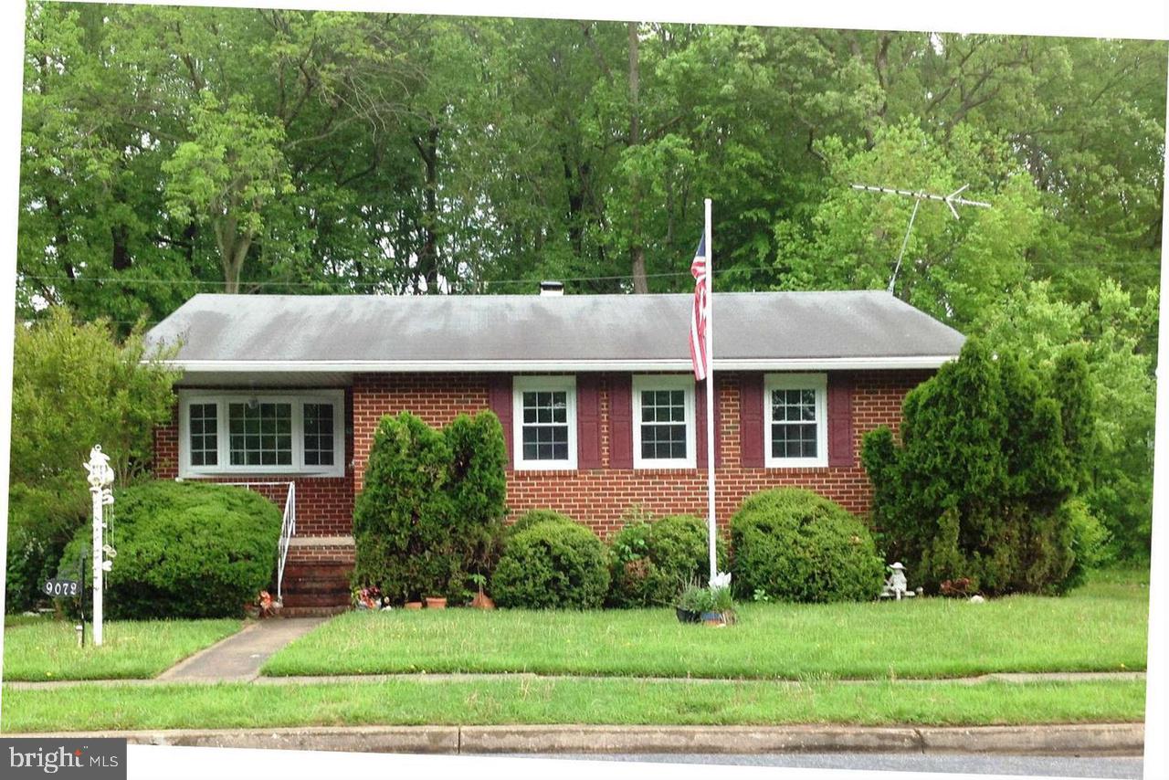 9072 Meadow Heights Road Randallstown, MD 21133 - Photo 1 of 16 a front view of a house with a yard