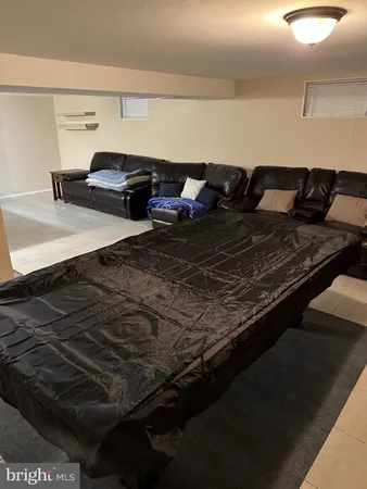 a room with furniture and air hockey table