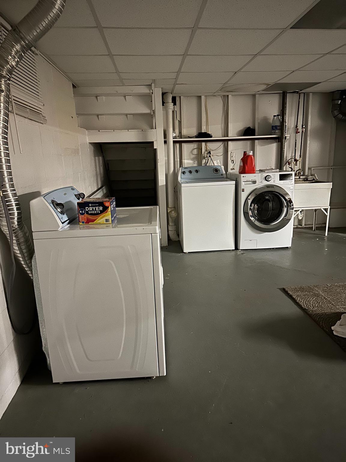 9072 Meadow Heights Road Randallstown, MD 21133 - Photo 14 of 16 a utility room with dryer and washer