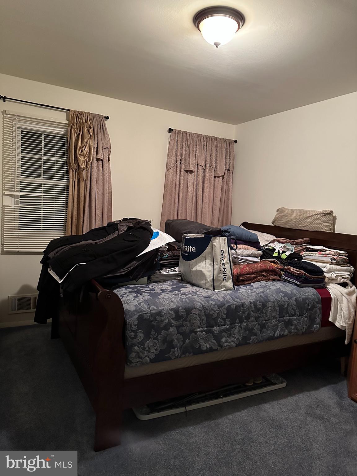 9072 Meadow Heights Road Randallstown, MD 21133 - Photo 6 of 16 a bedroom with a bed and walk in closet