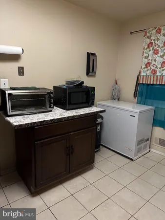 a kitchen with a cabinets and appliances