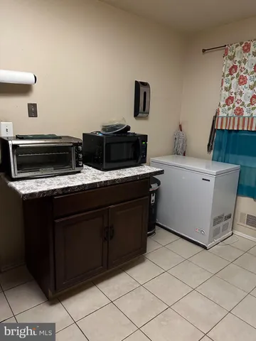 a kitchen with a cabinets and appliances