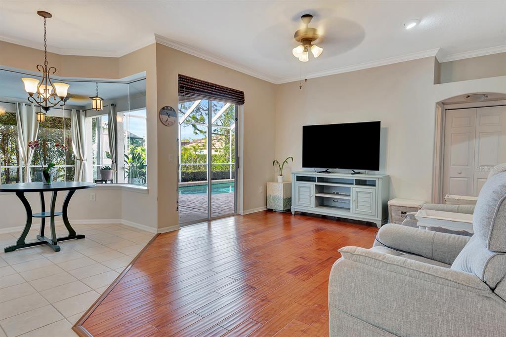 7344 Arrowhead Run Lakewood Ranch, FL 34202 - Photo 10 of 24 a living room with furniture and a flat screen tv