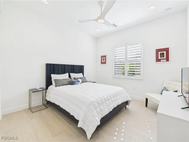 a bedroom with a bed and a table