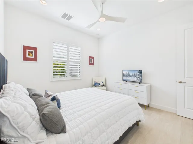 a bedroom with a bed and a cabinets