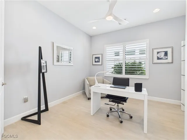 a workspace with furniture and a window