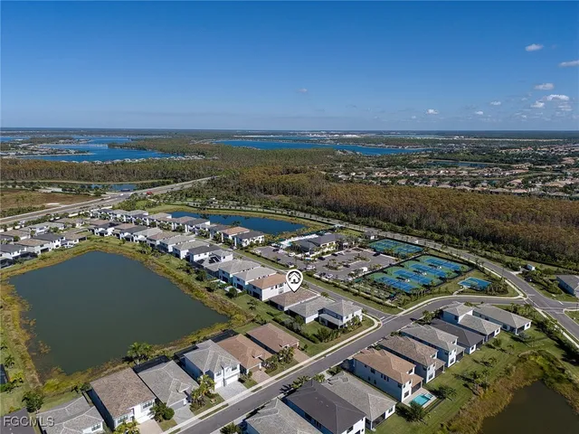 an aerial view of a city with ocean view
