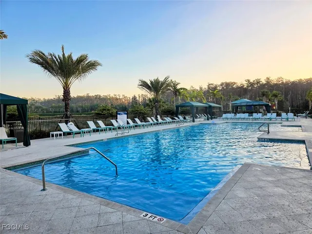 a view of swimming pool with outdoor seating