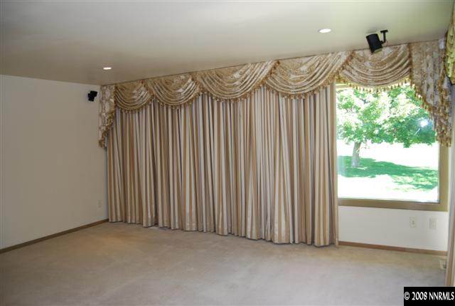 2570 Spinnaker Drive Reno, NV 89519 - Photo 5 of 9 a view of a room with a wooden floor and a window