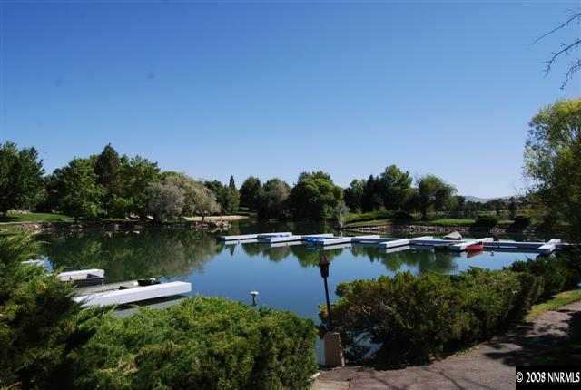 2570 Spinnaker Drive Reno, NV 89519 - Photo 9 of 9 a view of a lake with houses in the back