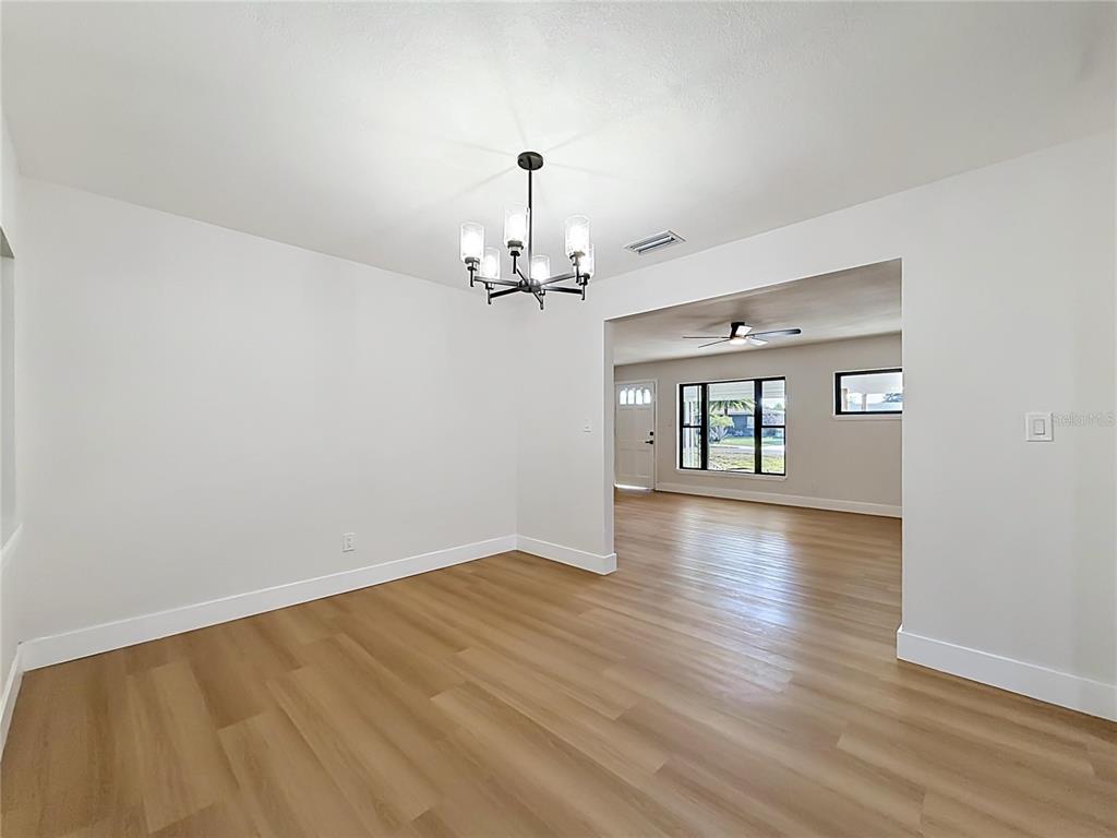 2105 Shaffer Place Orlando, FL 32806 - Photo 25 of 68 wooden floor in an empty room with a window