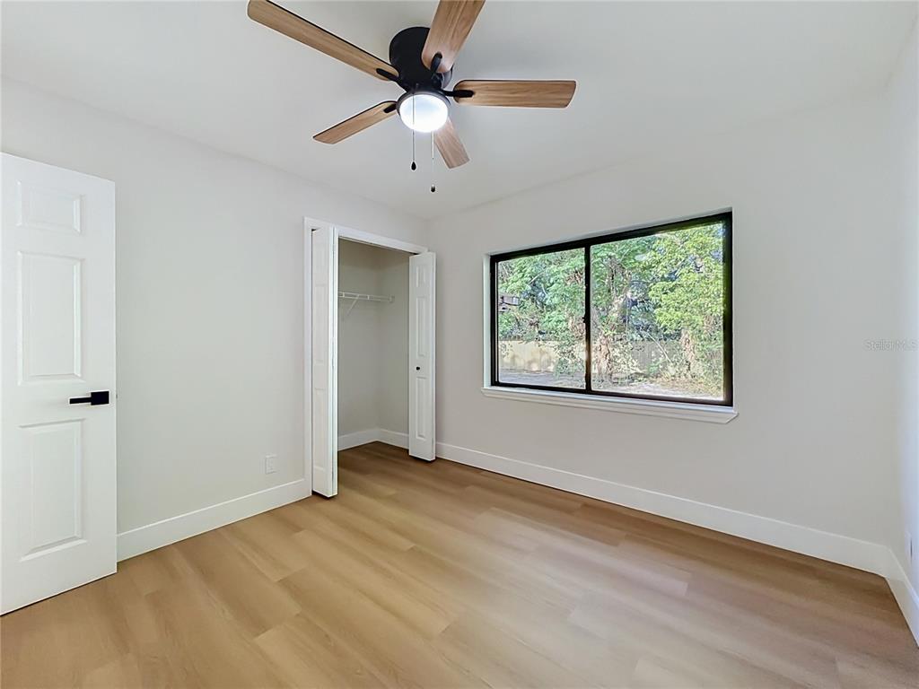 2105 Shaffer Place Orlando, FL 32806 - Photo 45 of 68 an empty room with a window and a fan