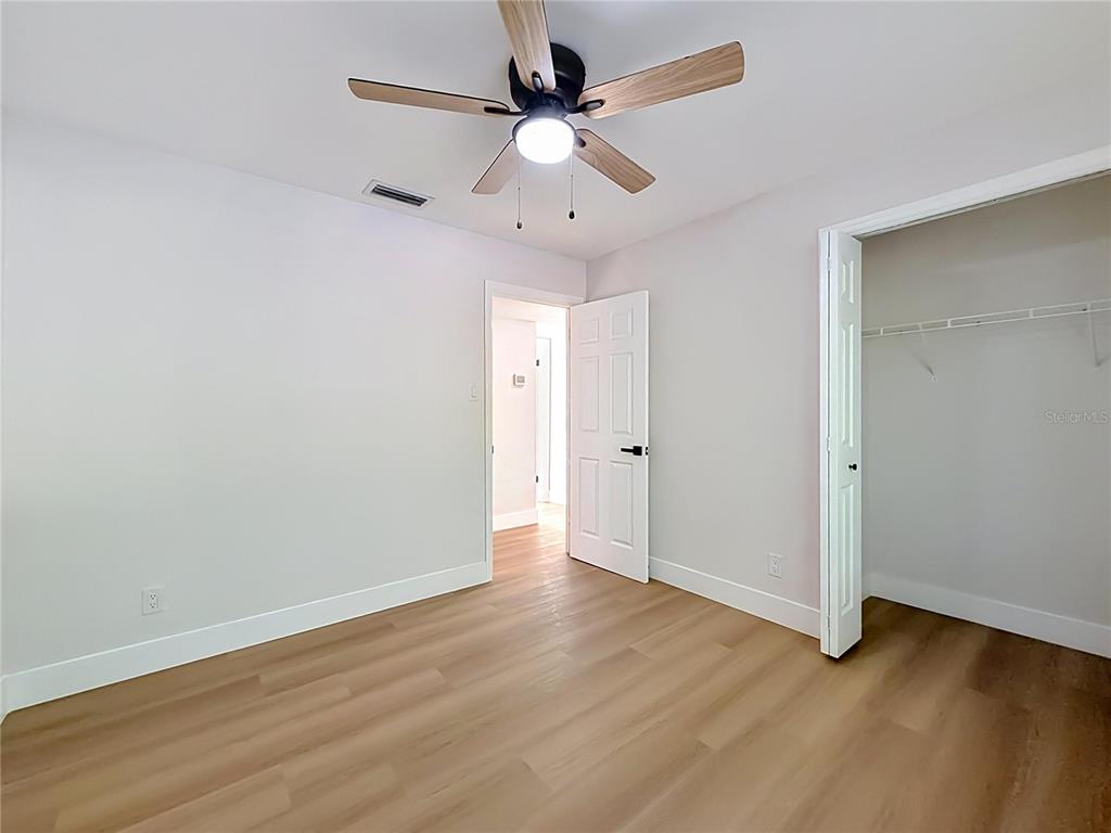 2105 Shaffer Place Orlando, FL 32806 - Photo 46 of 68 a view of an empty room with wooden floor