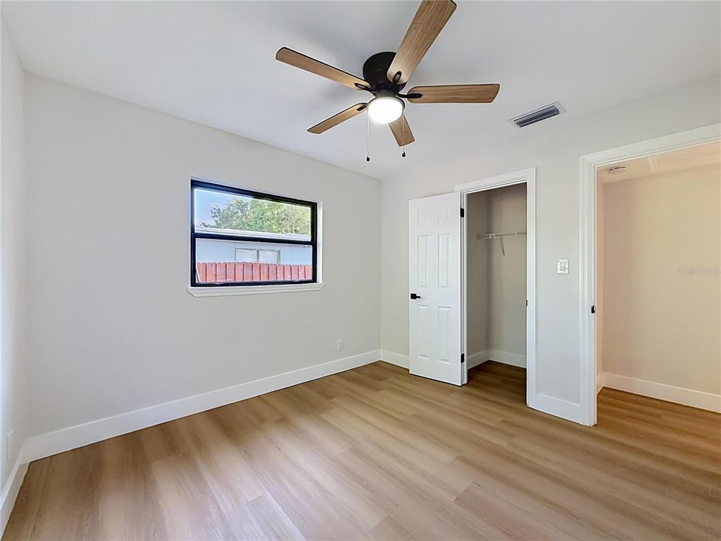 2105 Shaffer Place Orlando, FL 32806 - Photo 56 of 68 a view of an empty room with wooden floor