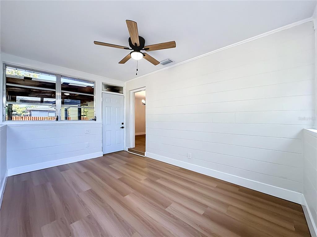 2105 Shaffer Place Orlando, FL 32806 - Photo 63 of 68 a view of empty room with wooden floor and fan