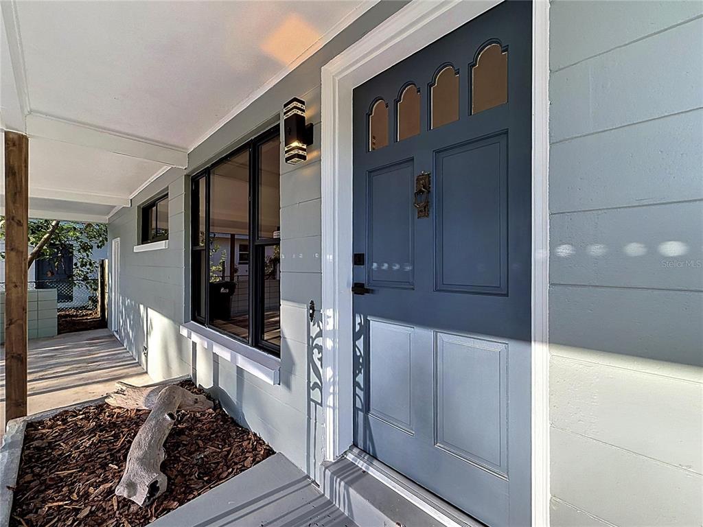 2105 Shaffer Place Orlando, FL 32806 - Photo 7 of 68 a view of a house with a door and wooden floor