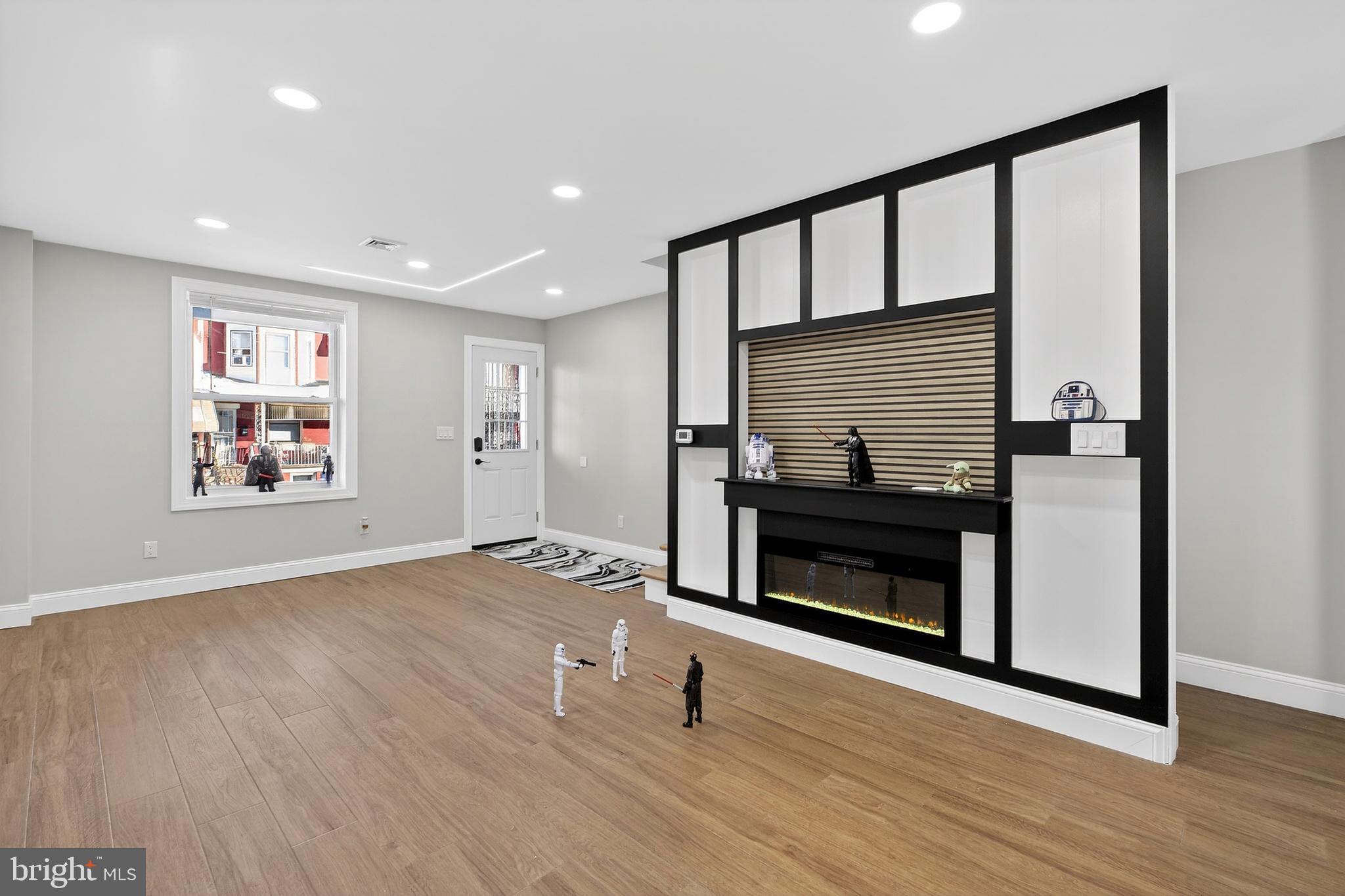 3450 Hurley Street Philadelphia, PA 19134 - Photo 12 of 31 a living room with wooden floor and a fireplace