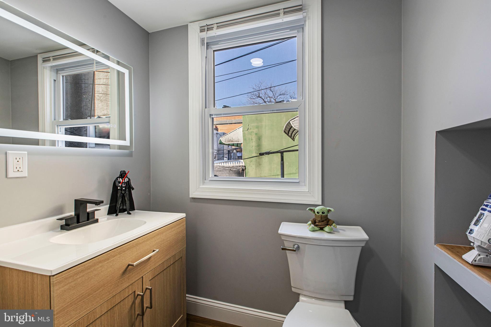 3450 Hurley Street Philadelphia, PA 19134 - Photo 20 of 31 a bathroom with a toilet sink and mirror