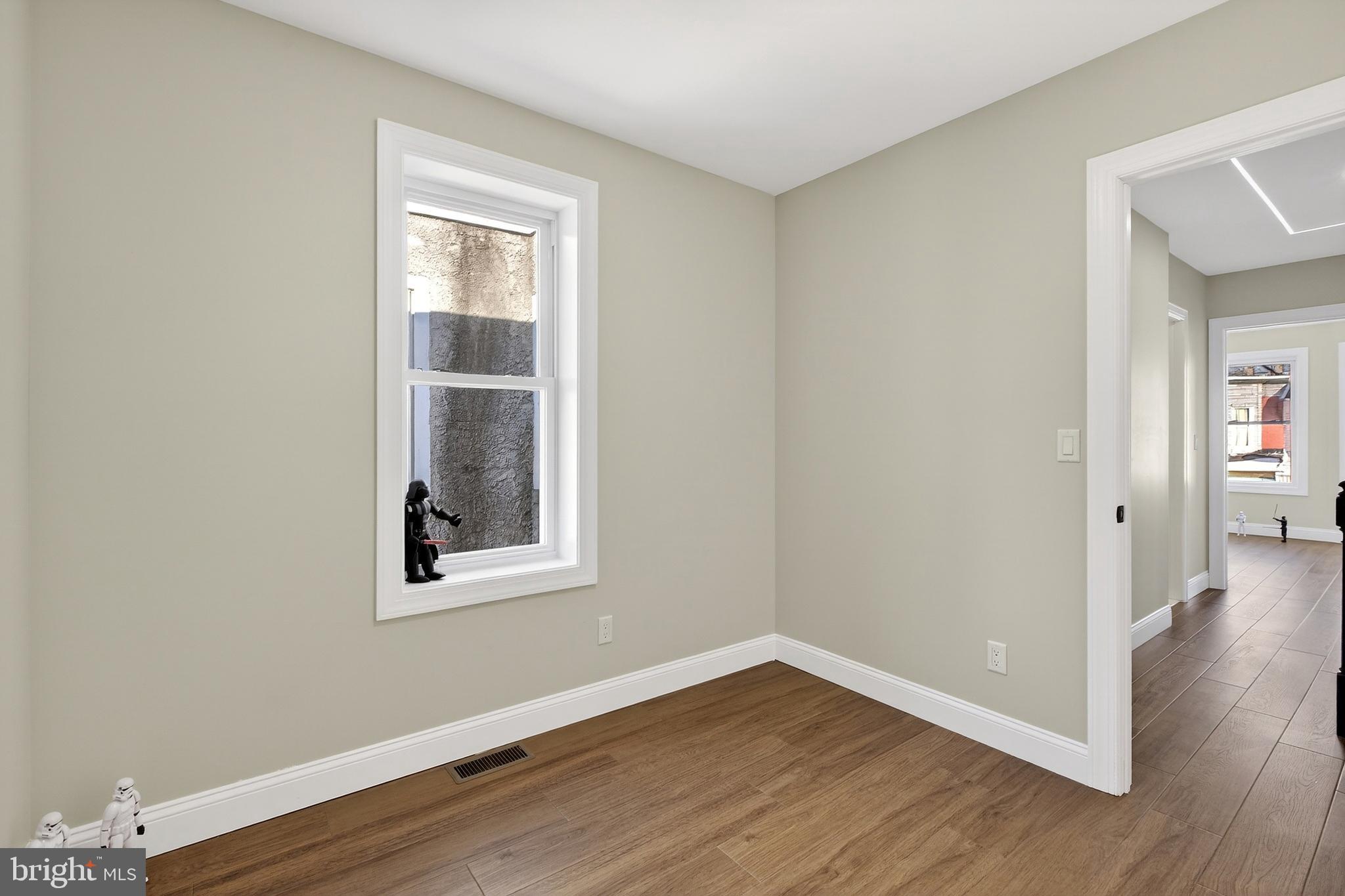 3450 Hurley Street Philadelphia, PA 19134 - Photo 26 of 31 a view of an empty room with wooden floor and a window