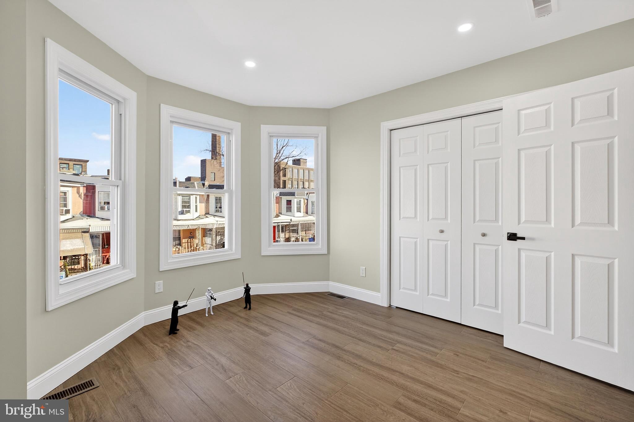 3450 Hurley Street Philadelphia, PA 19134 - Photo 28 of 31 a view of an empty room with a window and wooden floor