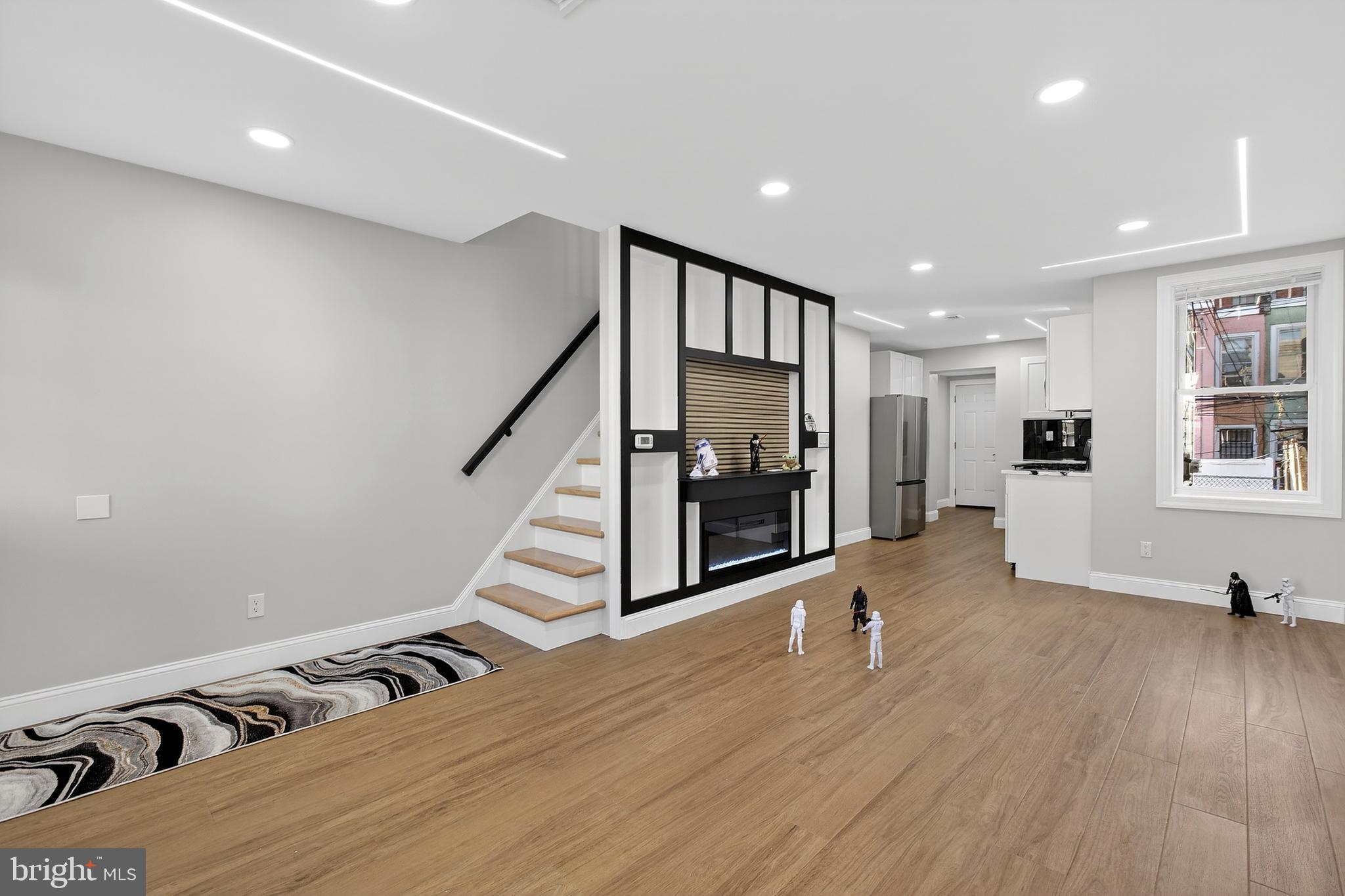 3450 Hurley Street Philadelphia, PA 19134 - Photo 9 of 31 a view of an empty room with wooden floor and stairs