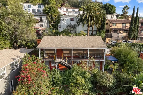 front view of a house with a garden