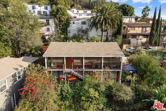 front view of a house with a garden
