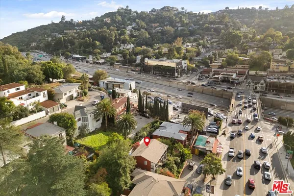 an aerial view of a house with swimming pool