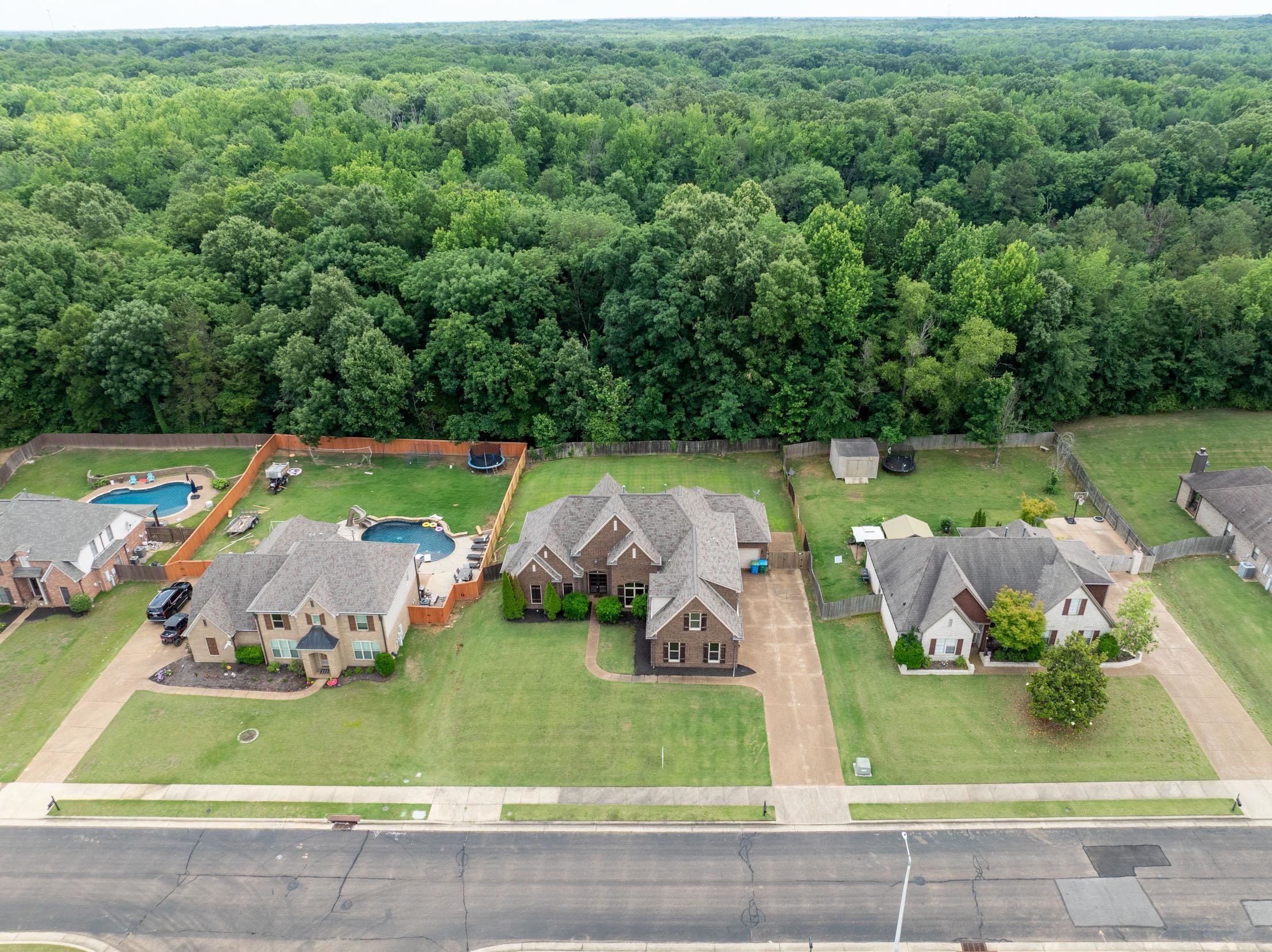 5380 Scarlet Ridge Drive Arlington, TN 38002 - Photo 34 of 35 Aerial overview of a residential property featuring a brick exterior and a multi-gabled roofline