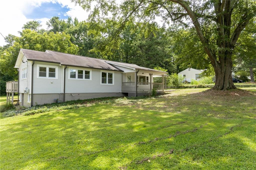 501 Ridge Avenue Mableton, GA 30126 - Photo 1 of 1 a view of a backyard with plants and large tree