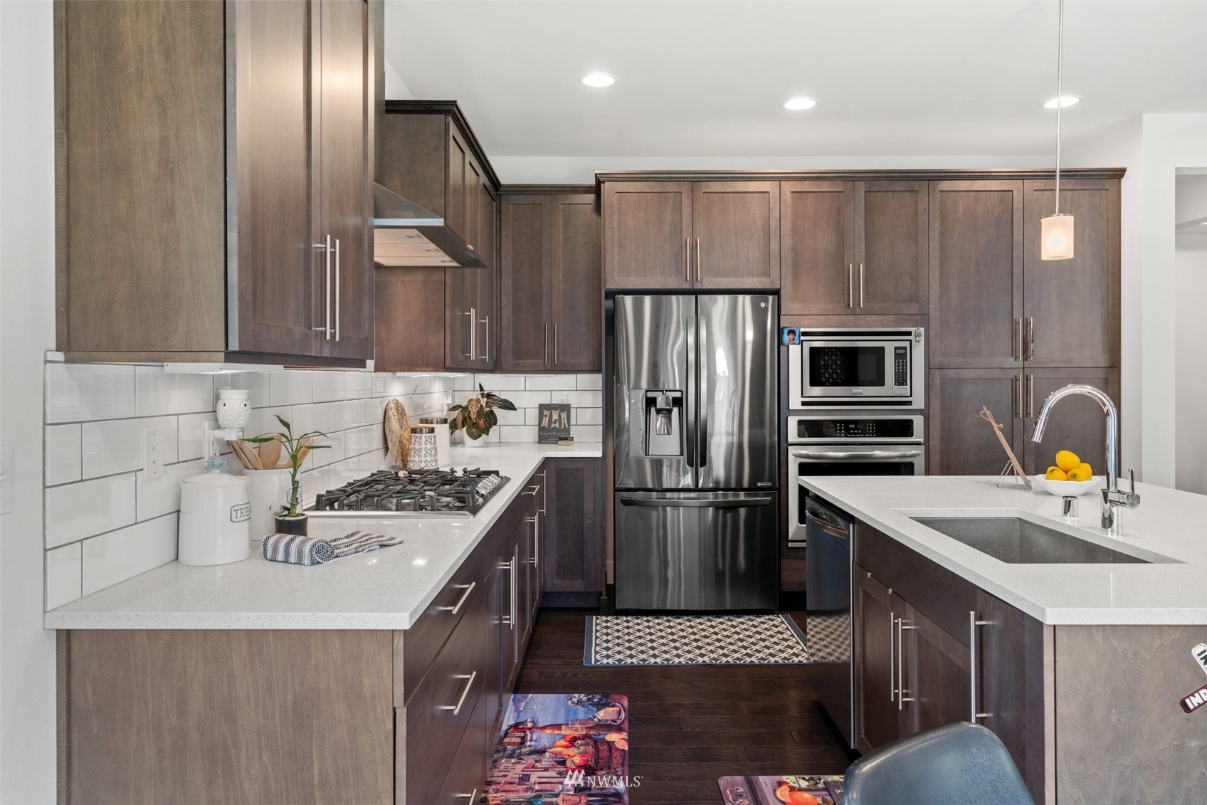 3720 194th Place Southeast Bothell, WA 98012 - Photo 17 of 36 a kitchen with stainless steel appliances granite countertop a sink stove and refrigerator