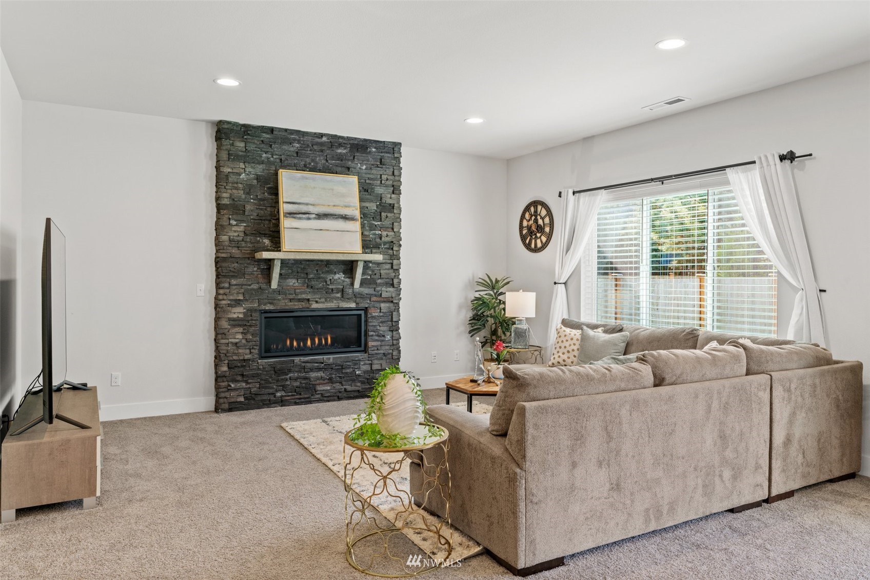 3720 194th Place Southeast Bothell, WA 98012 - Photo 18 of 36 a living room with furniture and a flat screen tv