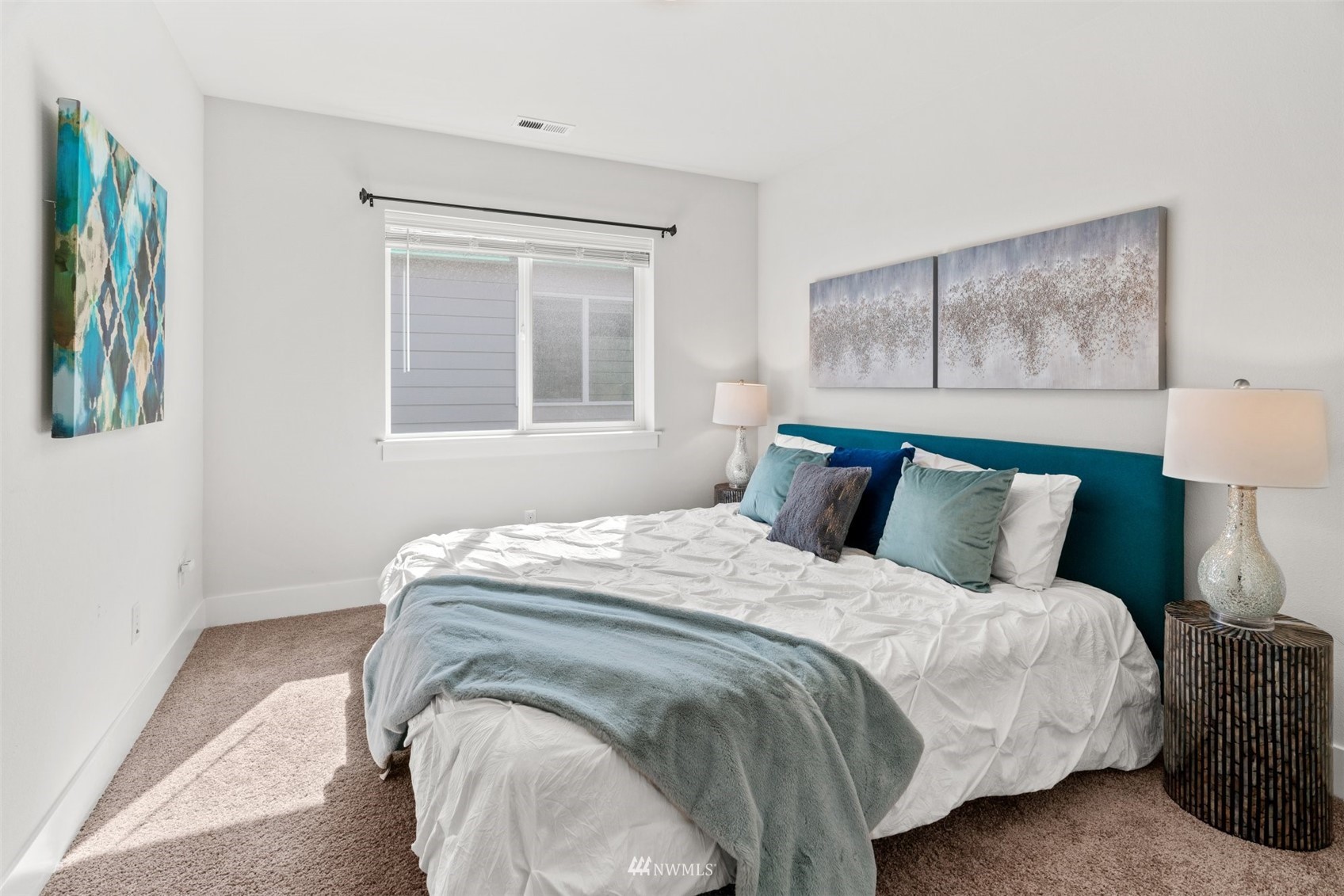 3720 194th Place Southeast Bothell, WA 98012 - Photo 30 of 36 a bed sitting in a bedroom next to a window
