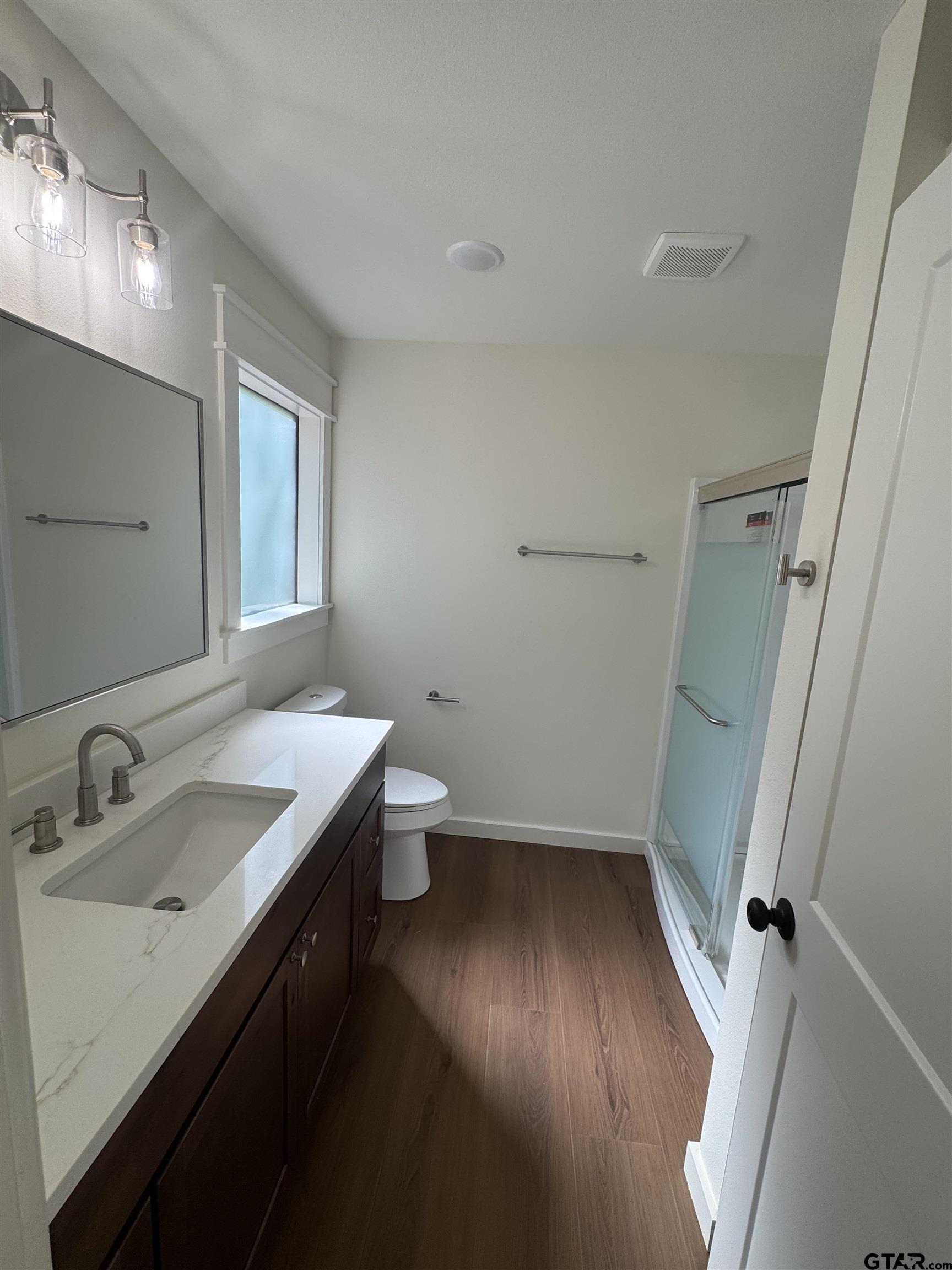 21070-c R 4147 C R 4147 Lindale, TX 75771 - Photo 14 of 23 a bathroom with a sink and a mirror