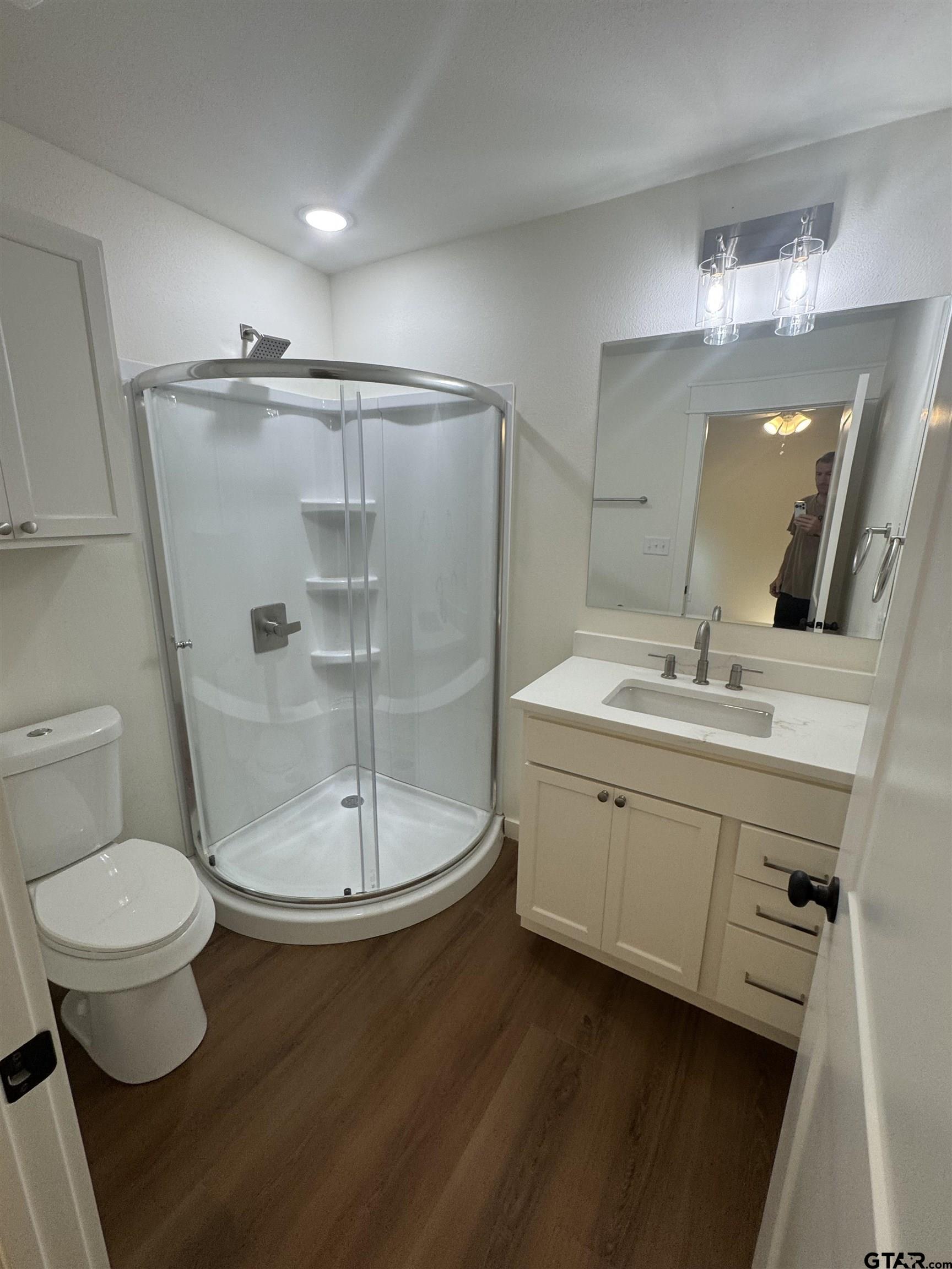 21070-c R 4147 C R 4147 Lindale, TX 75771 - Photo 17 of 23 a bathroom with a double vanity sink toilet and a mirror