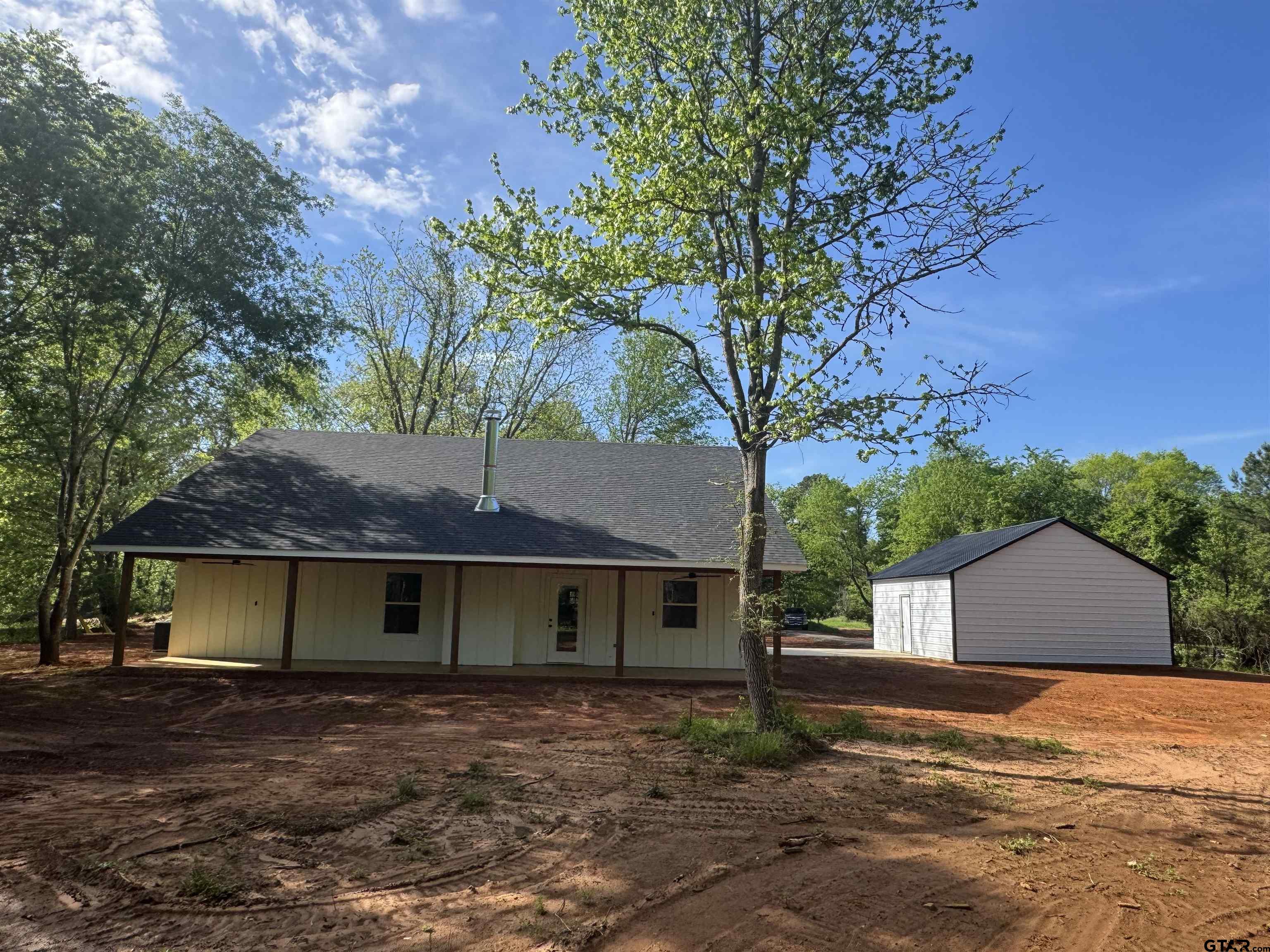 21070-c R 4147 C R 4147 Lindale, TX 75771 - Photo 23 of 23 a view of a house with a yard