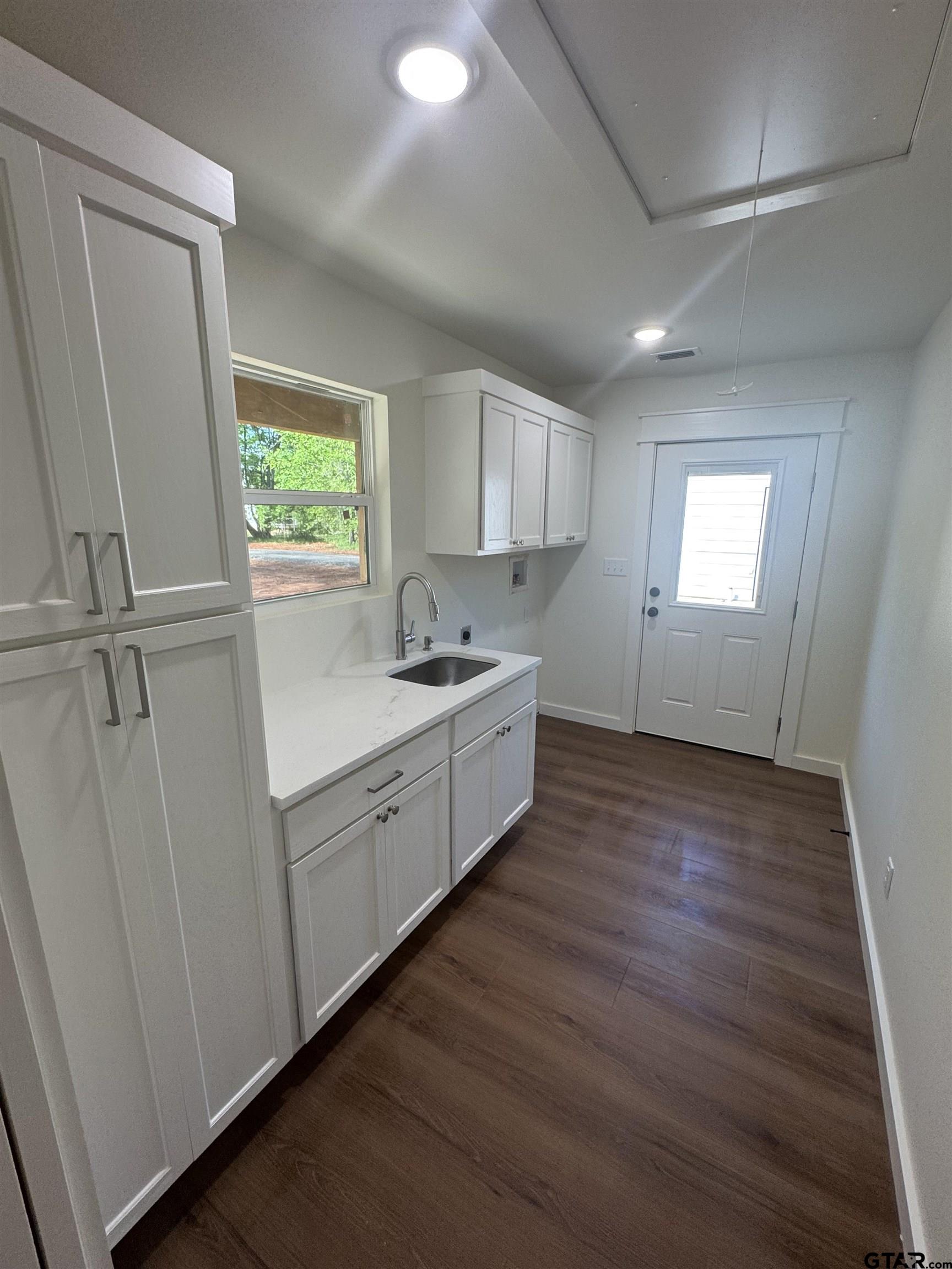 21070-c R 4147 C R 4147 Lindale, TX 75771 - Photo 8 of 23 a kitchen with a sink window and cabinets