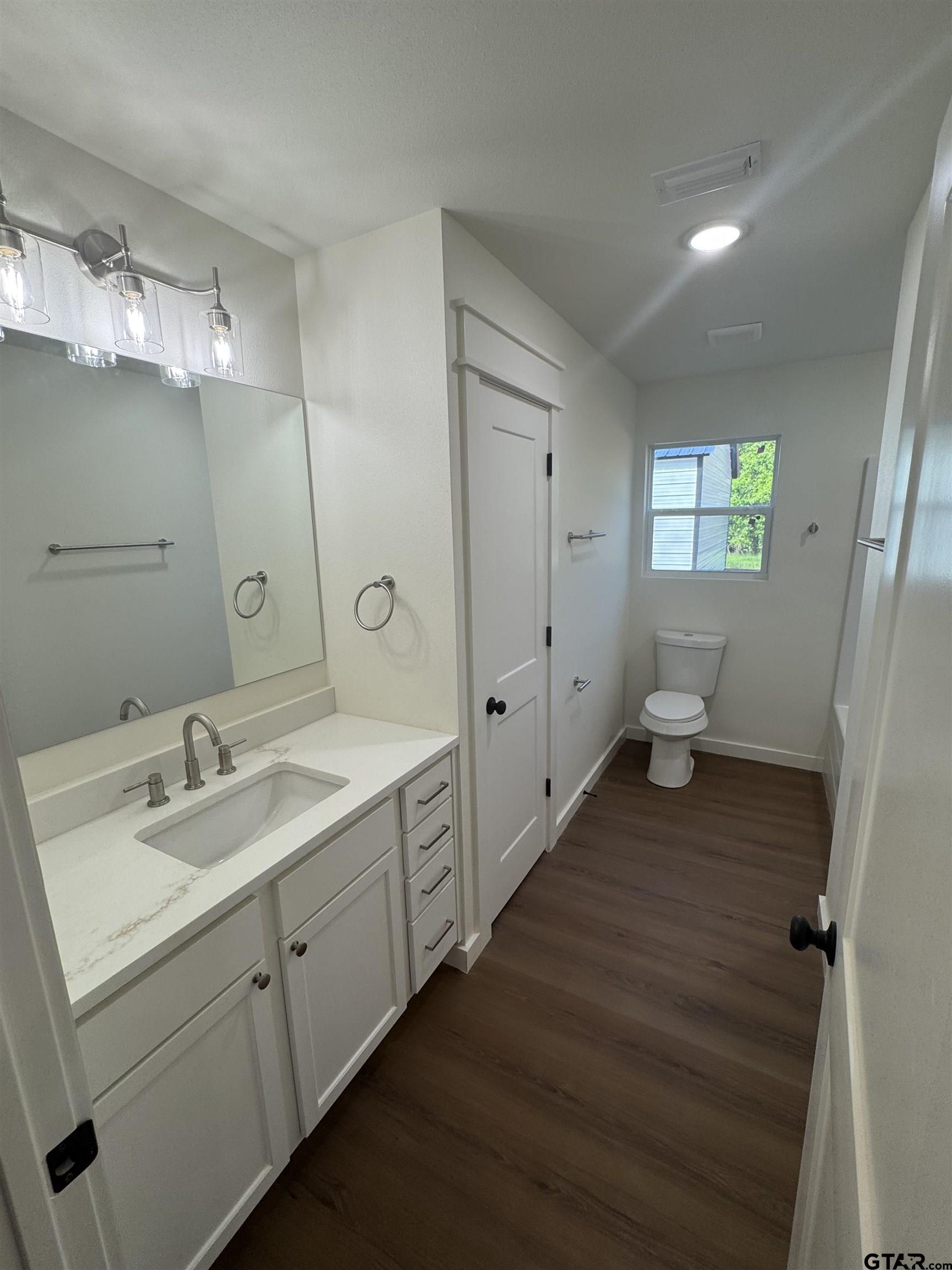 21070-c R 4147 C R 4147 Lindale, TX 75771 - Photo 10 of 23 a bathroom with a sink and mirror