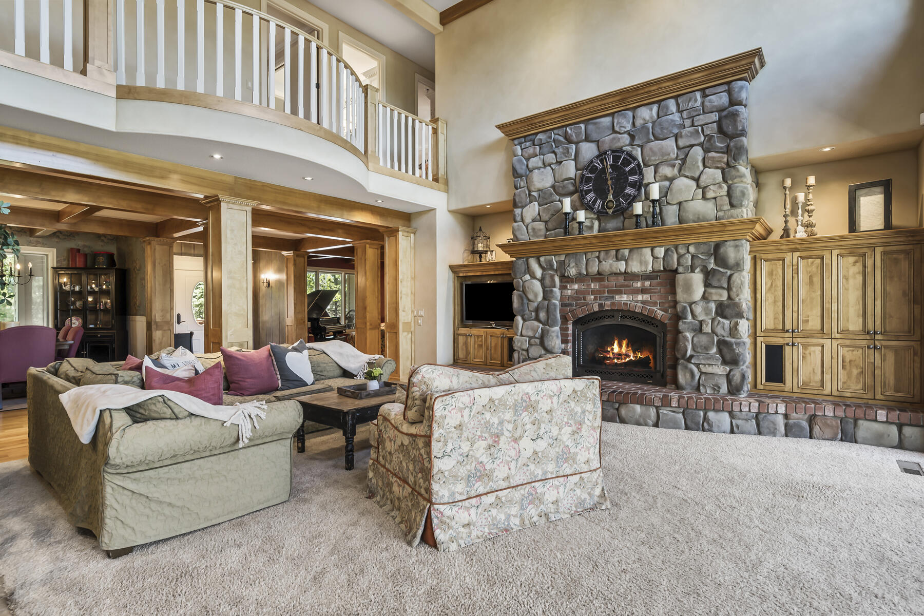 61445 Gosney Road Bend, OR 97702 - Photo 36 of 83 a living room with furniture a fireplace and a large window