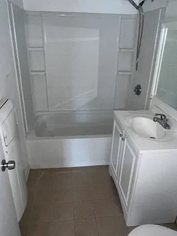 a bathroom with a sink and a bathtub