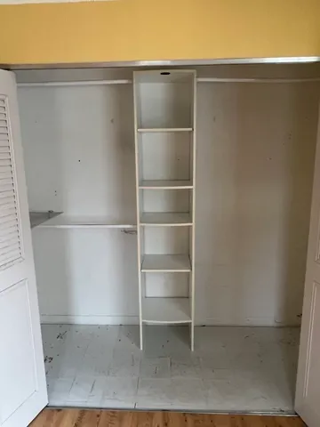 a view of an empty walk in closet
