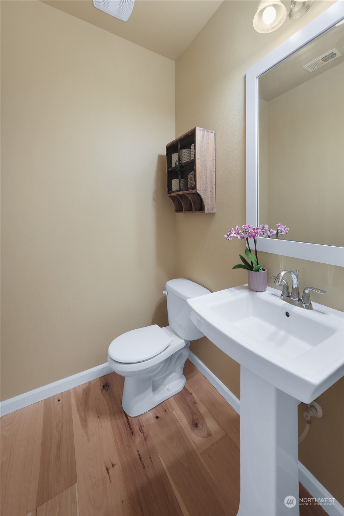 21907 37th Drive Southeast, Unit 30 Bothell, WA 98021 - Photo 13 of 27 a bathroom with a sink a toilet and mirror